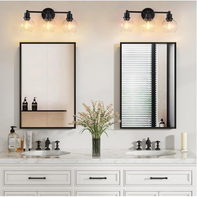 Navya Modern 3-Light Bathroom Sconces with Clear Glass Shades Navya Modern 3-Light Bathroom Sconces with Clear Glass Shades