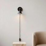 Anoushka Minimalist Black Cast Wall Sconce Anoushka Minimalist Black Cast Wall Sconce
