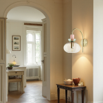 Oryn Globe Glass Brass Wall Light