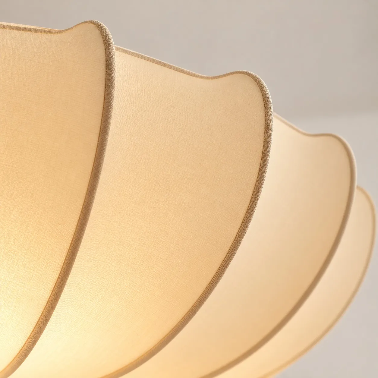 Close view of white fabric shade and curved ribs