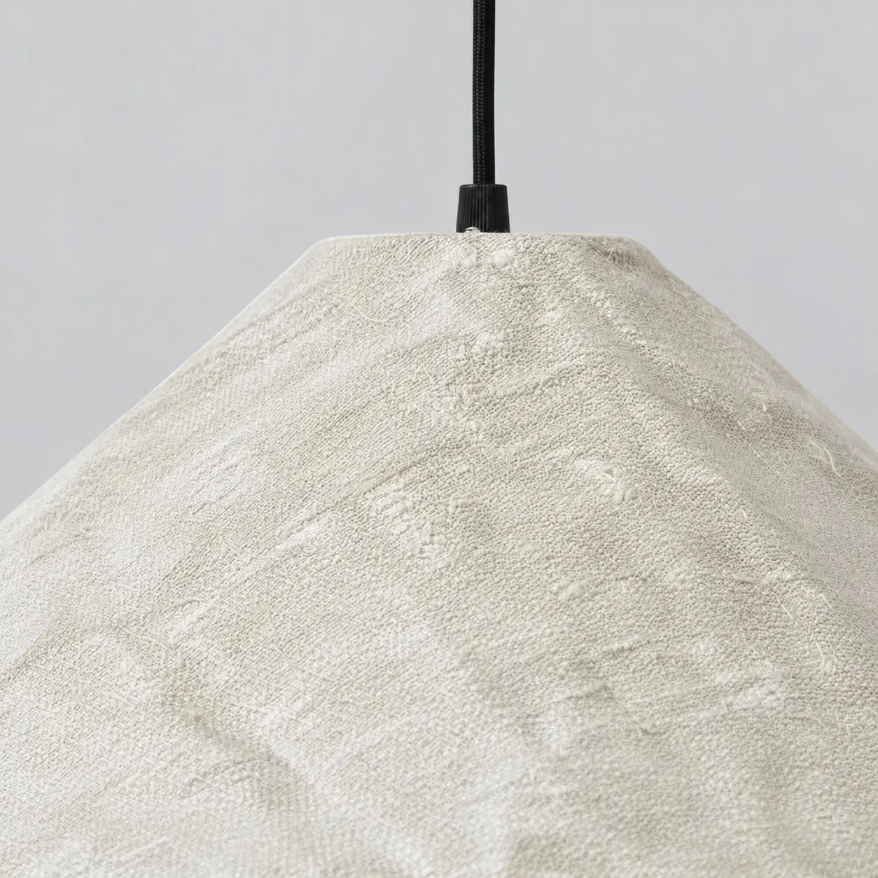Close-up of fabric texture and dark suspension connection