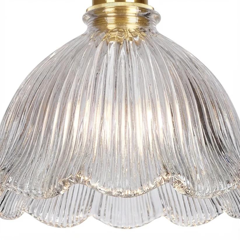 Close-up of clear ribbed glass and the scalloped lower edge