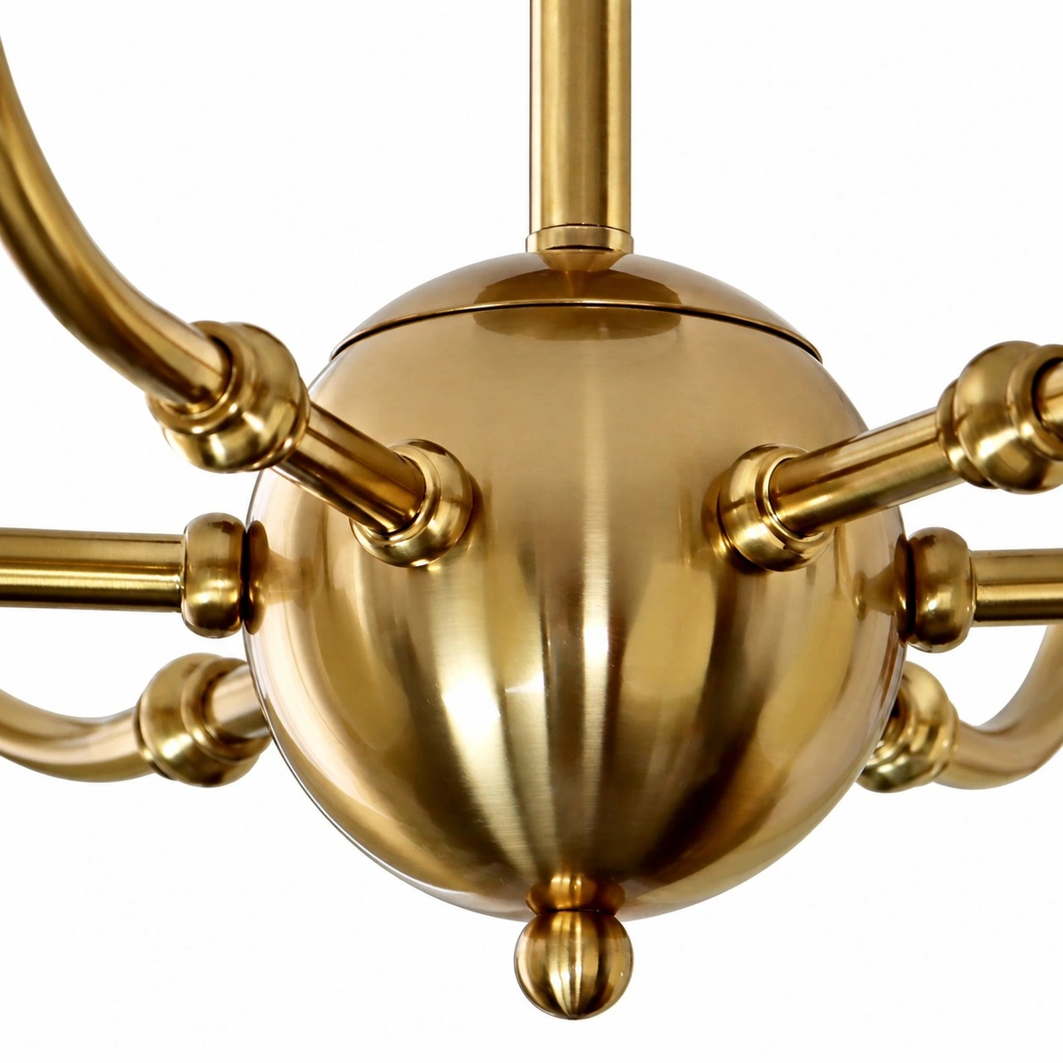 Close view of the gold center sphere and curved arms