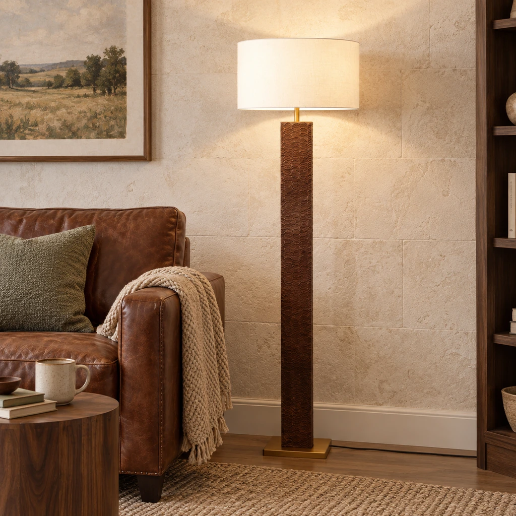 Nora textured wood floor lamp beside a leather reading chair