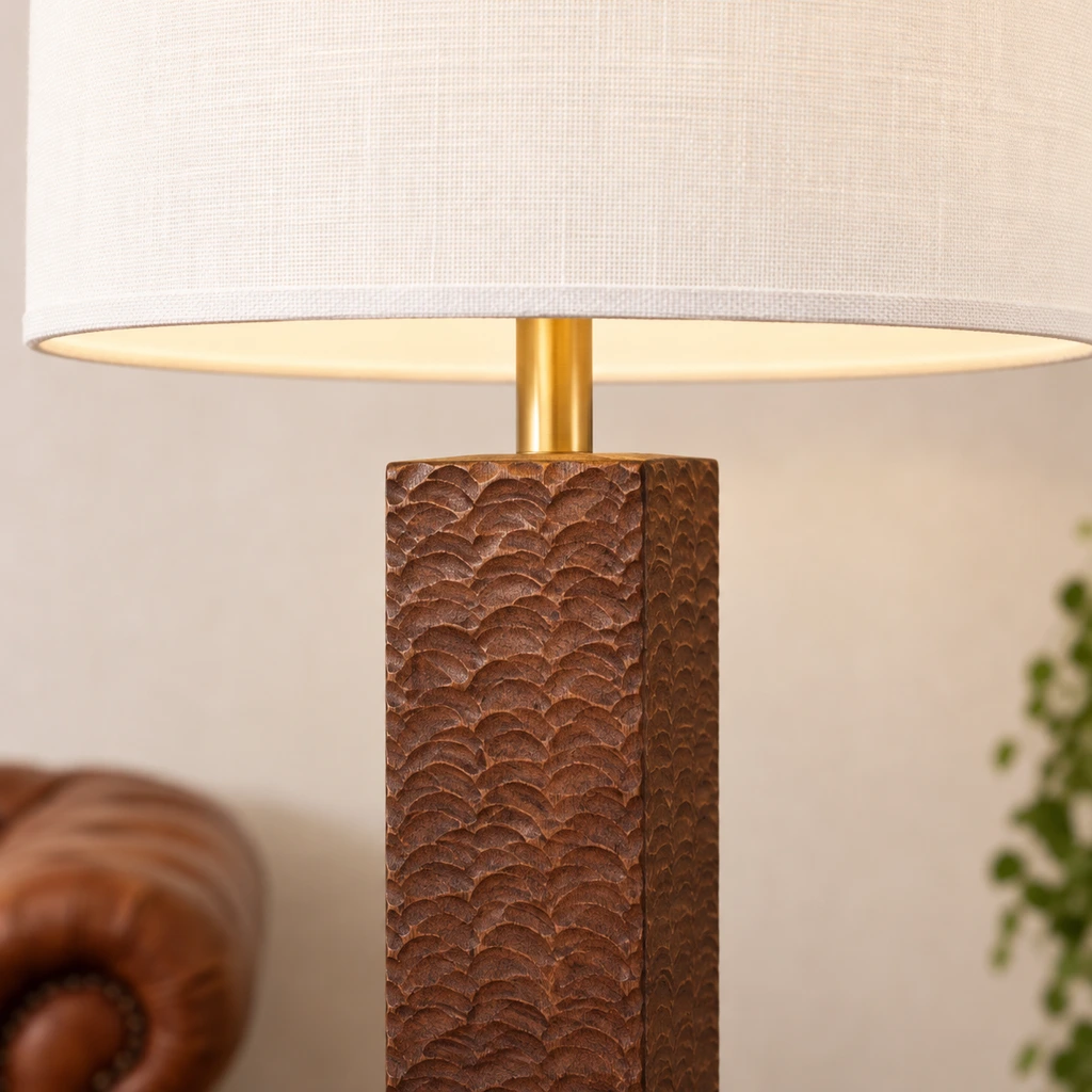 Close detail of Nora white fabric shade and brass neck