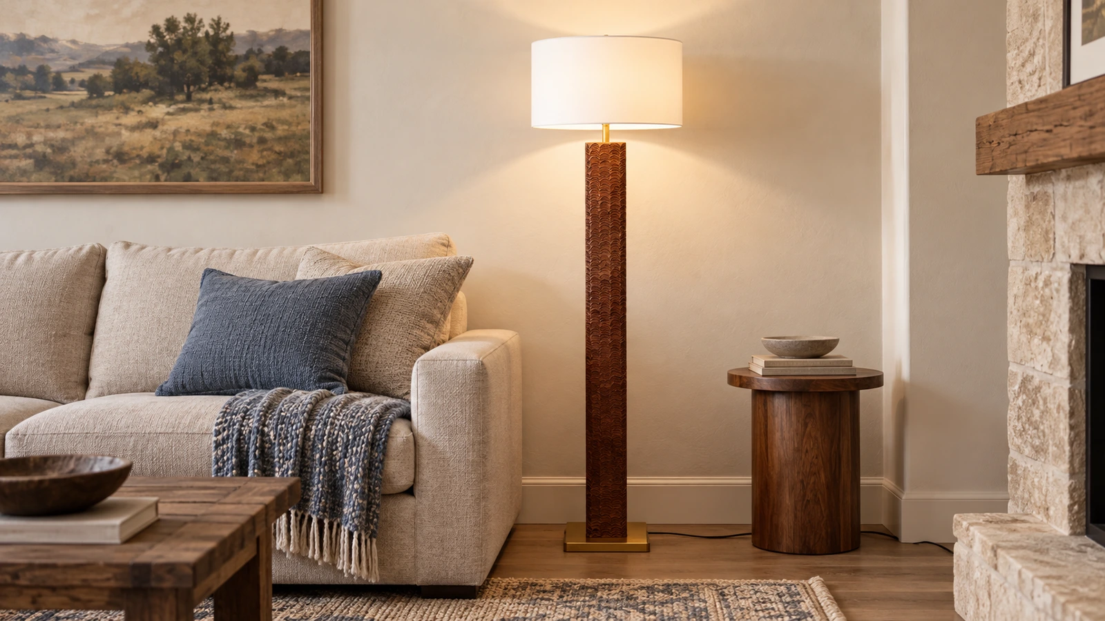 Nora textured wood floor lamp beside an oatmeal sofa in an American Rustic room